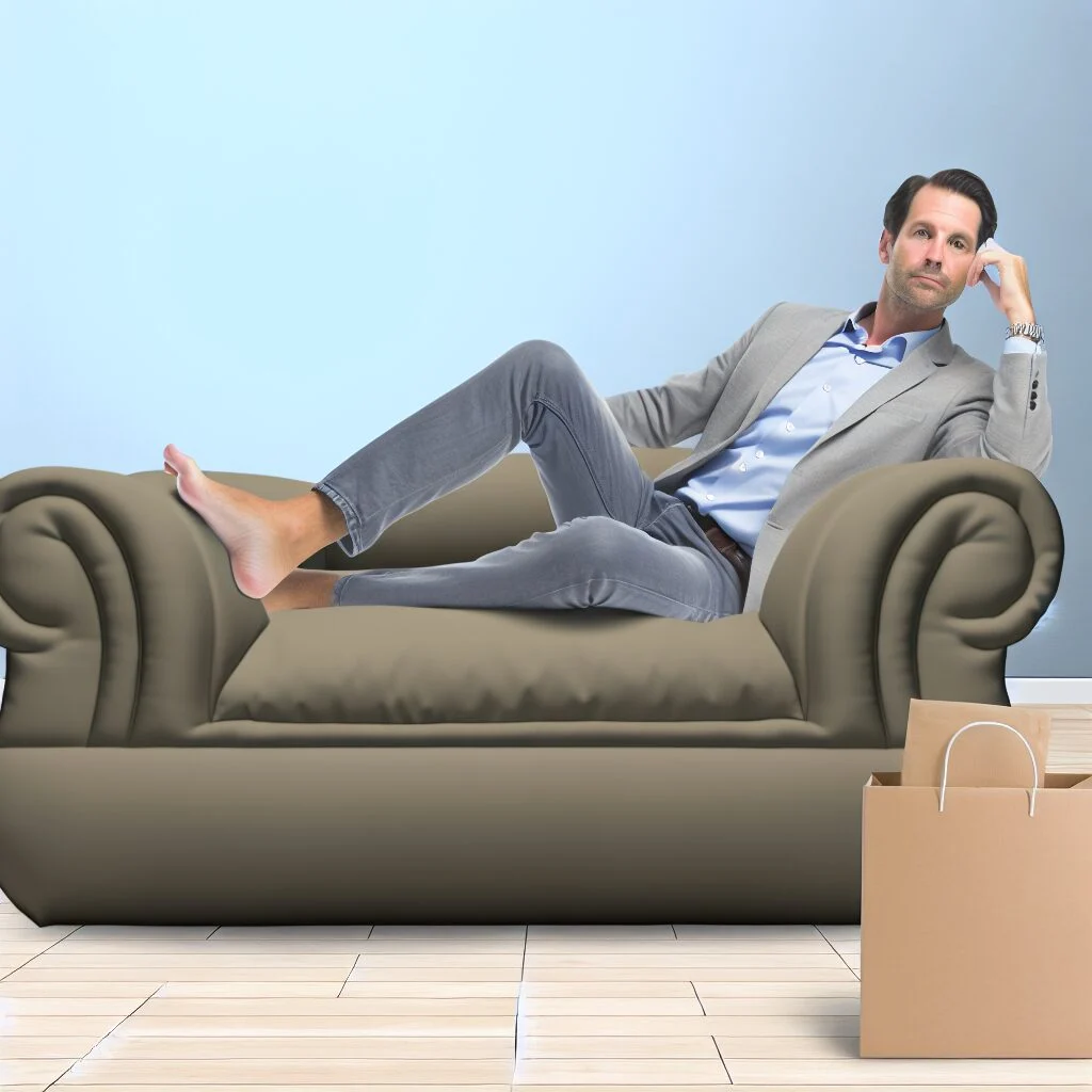 Man lounging on Amazon human dog bed in minimalist living room